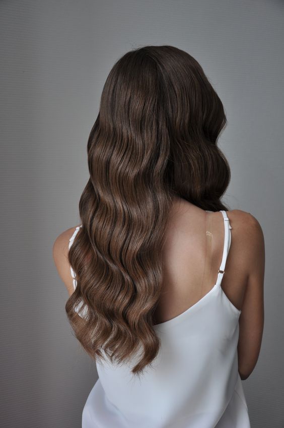 Women's haircut and blow-dry from a hairdresser Hallam clients trust, showing soft brunette waves