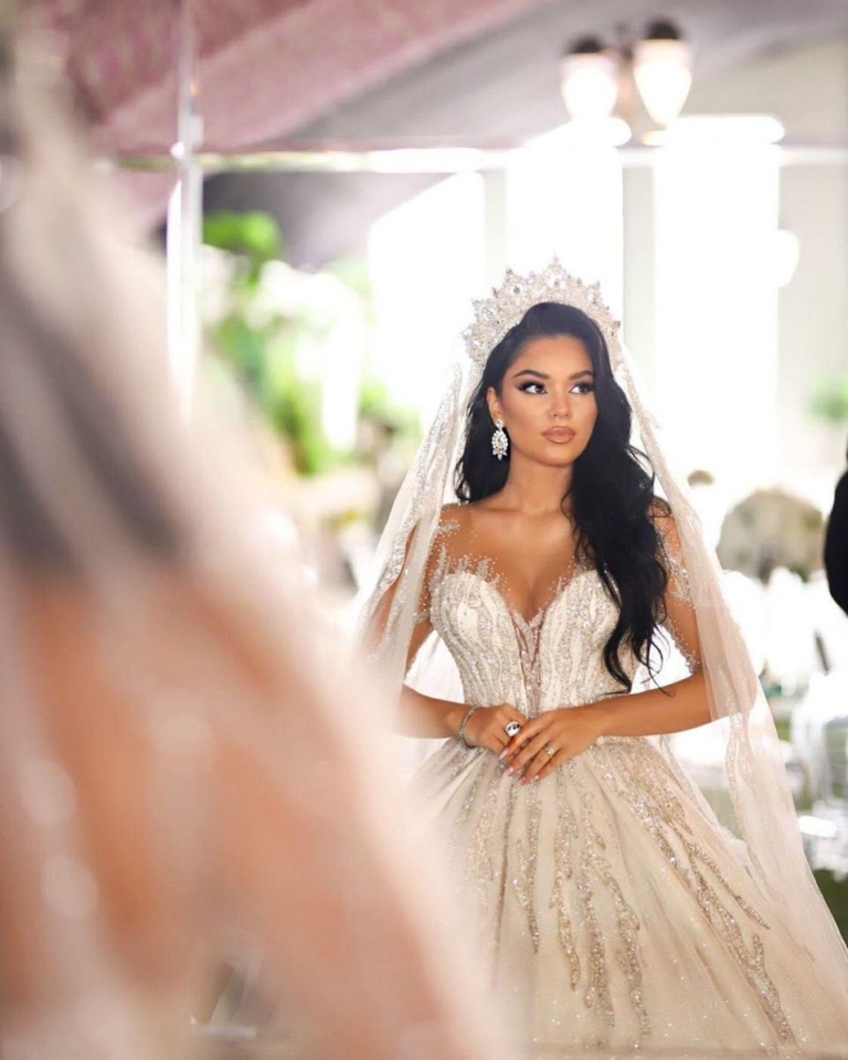 Bride with long glossy waves, a tiara and veil, showing bridal hair Endeavour Hills brides love